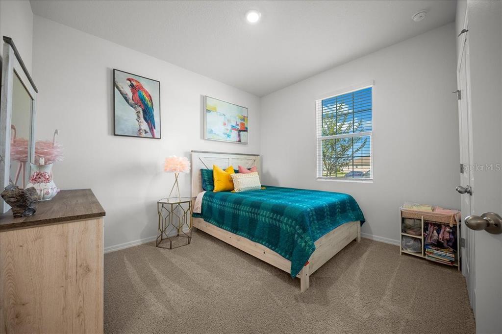 8598 Southwest 59th Terrace Ocala, FL 34476 - Photo 50 of 73 a bedroom with a bed and a window