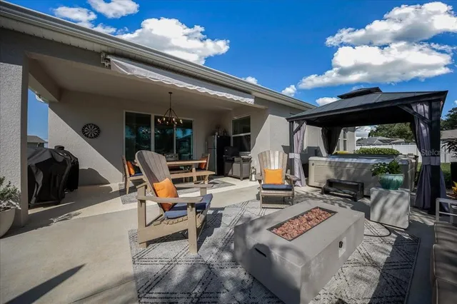 a view of a patio with swimming pool table and chairs