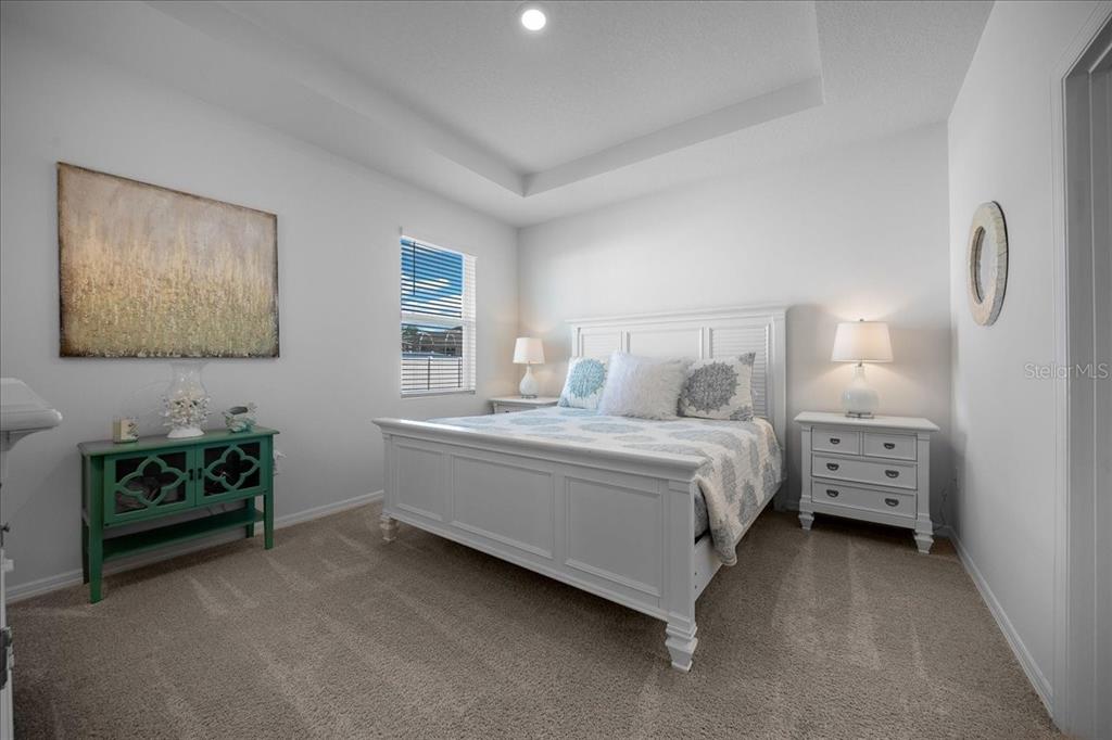 8598 Southwest 59th Terrace Ocala, FL 34476 - Photo 52 of 73 a bedroom with a bed and a dresser