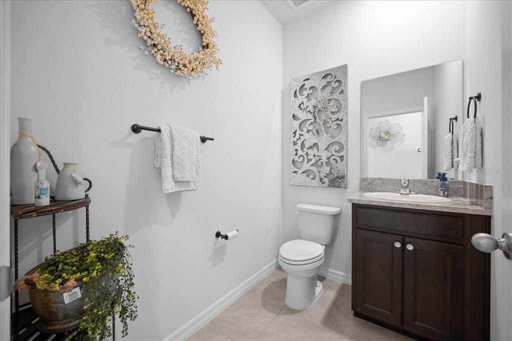 8598 Southwest 59th Terrace Ocala, FL 34476 - Photo 55 of 73 a spacious bathroom with a toilet sink and mirror