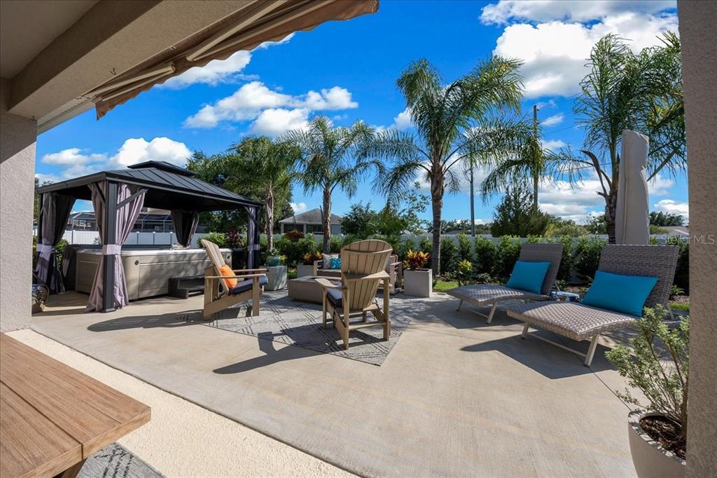 8598 Southwest 59th Terrace Ocala, FL 34476 - Photo 6 of 73 a view of a patio with swimming pool table and chairs