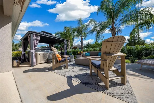 a view of a sitting area with furniture and a fire pit