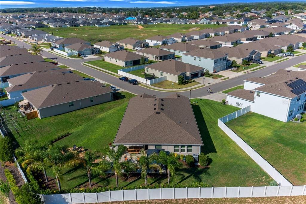 8598 Southwest 59th Terrace Ocala, FL 34476 - Photo 71 of 73 an aerial view of a house with a garden and lake view