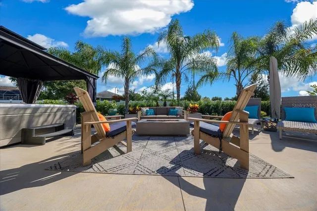 a view of a patio with a table and chairs