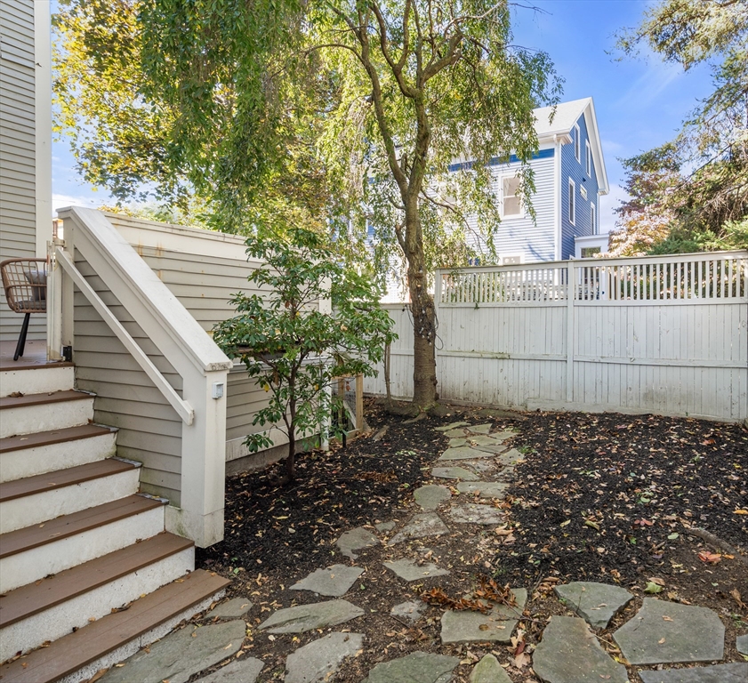 15 Roberts Road, Unit D Cambridge, MA 02138 - Photo 24 of 25 a view of a backyard with a trees