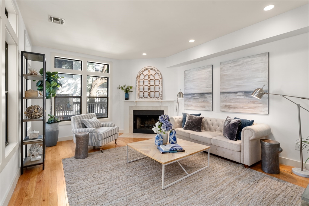 15 Roberts Road, Unit D Cambridge, MA 02138 - Photo 3 of 25 a living room with furniture fireplace and a large window