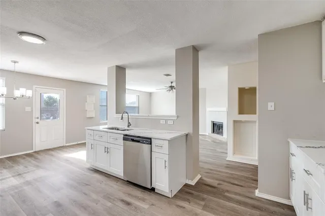 a kitchen with stainless steel appliances granite countertop a stove and a sink