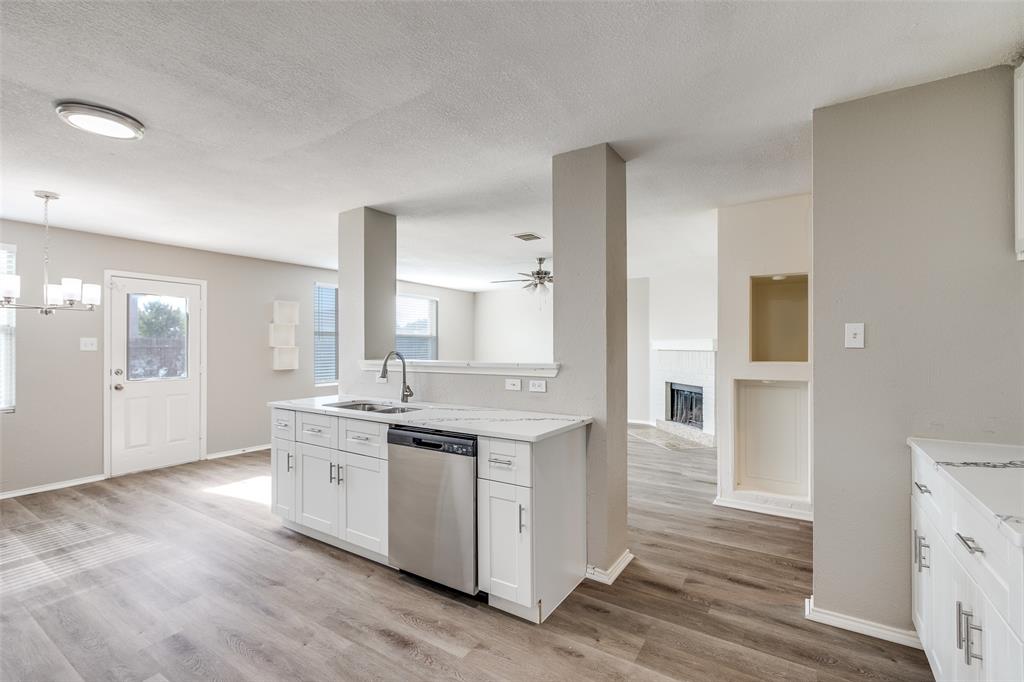 2624 Misty Harbor Drive Little Elm, TX 75068 - Photo 11 of 25 a kitchen with stainless steel appliances granite countertop a stove and a sink
