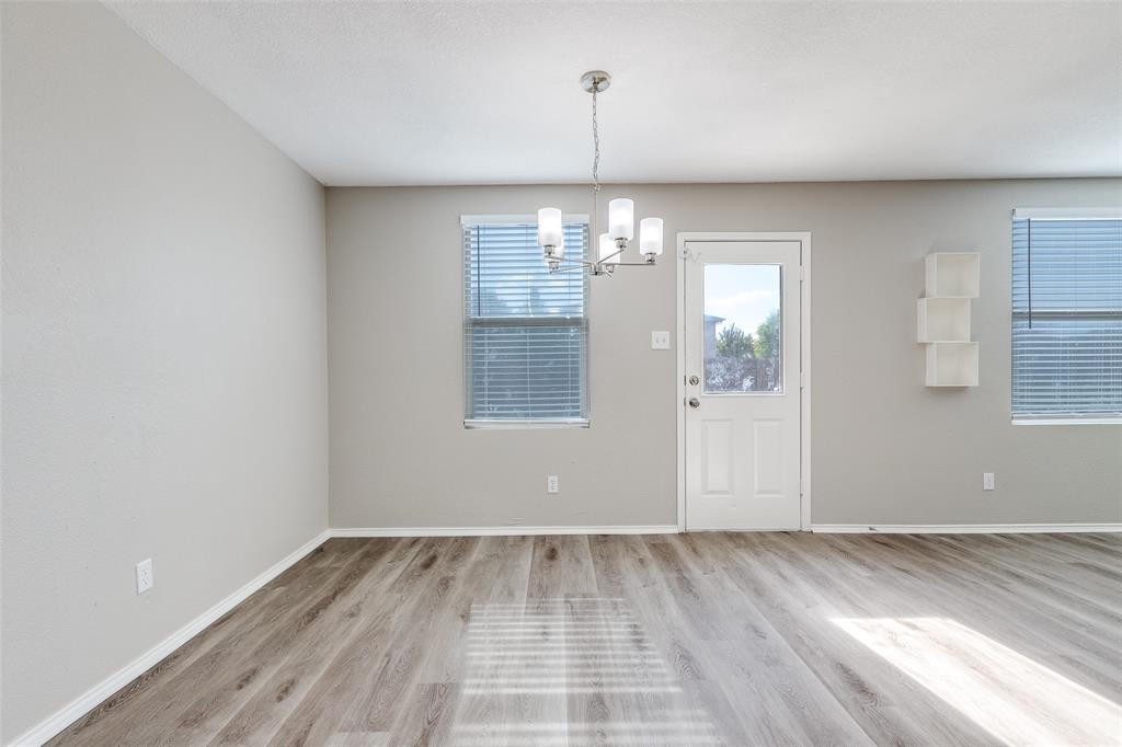 2624 Misty Harbor Drive Little Elm, TX 75068 - Photo 13 of 25 wooden floor in an empty room with a window