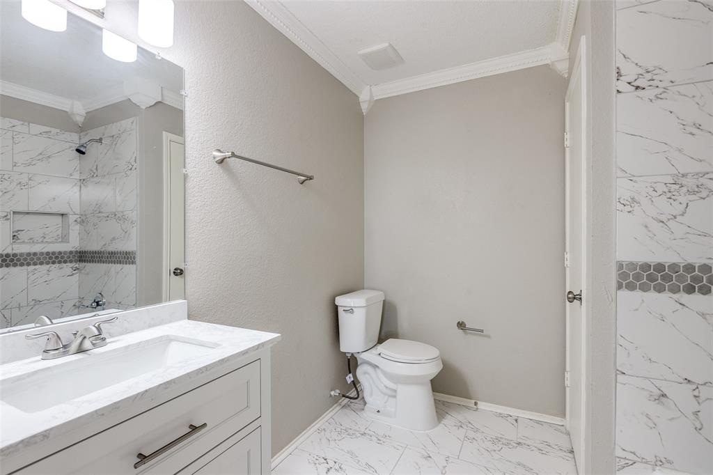 2624 Misty Harbor Drive Little Elm, TX 75068 - Photo 17 of 25 a bathroom with a sink a toilet and shower
