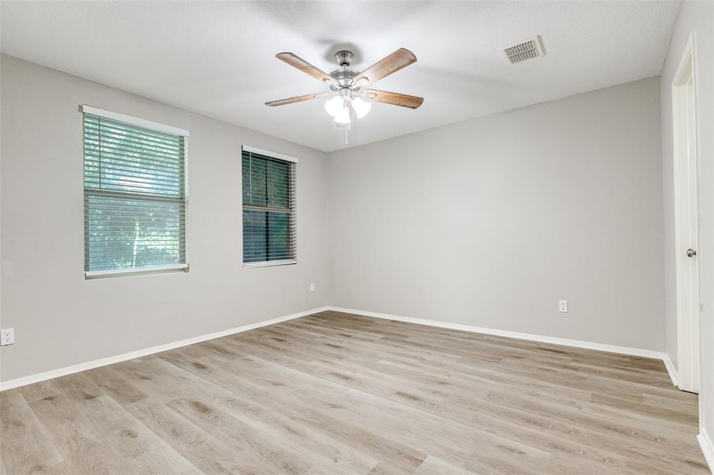 2624 Misty Harbor Drive Little Elm, TX 75068 - Photo 18 of 25 wooden floor in an empty room with a window