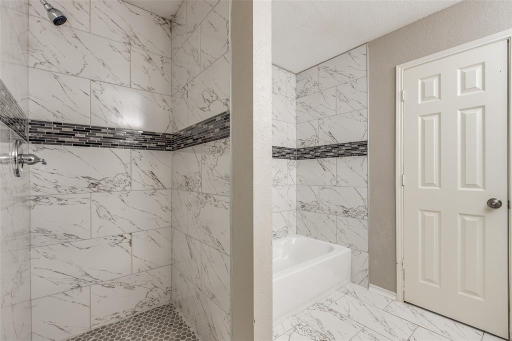 2624 Misty Harbor Drive Little Elm, TX 75068 - Photo 22 of 25 a bathroom with a shower
