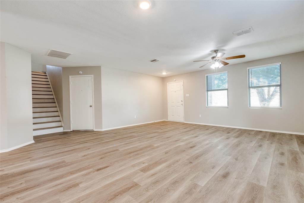2624 Misty Harbor Drive Little Elm, TX 75068 - Photo 6 of 25 an empty room with wooden floor and windows