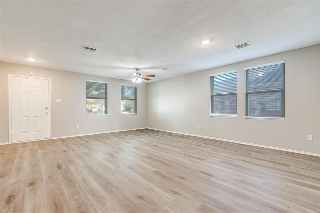 2624 Misty Harbor Drive Little Elm, TX 75068 - Photo 7 of 25 wooden floor in an empty room with a window