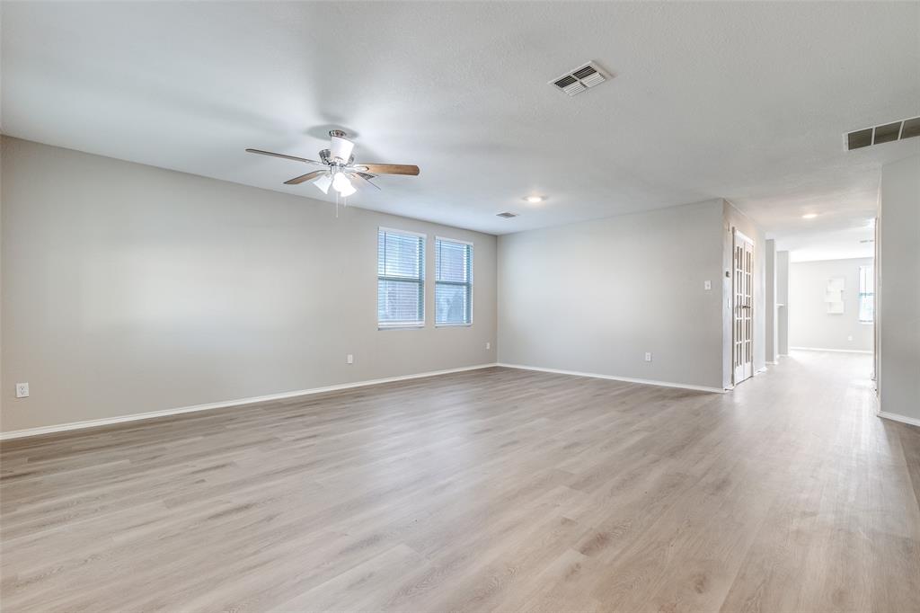 2624 Misty Harbor Drive Little Elm, TX 75068 - Photo 8 of 25 wooden floor in an empty room with a window