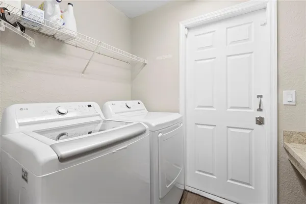 a utility room with dryer and washer