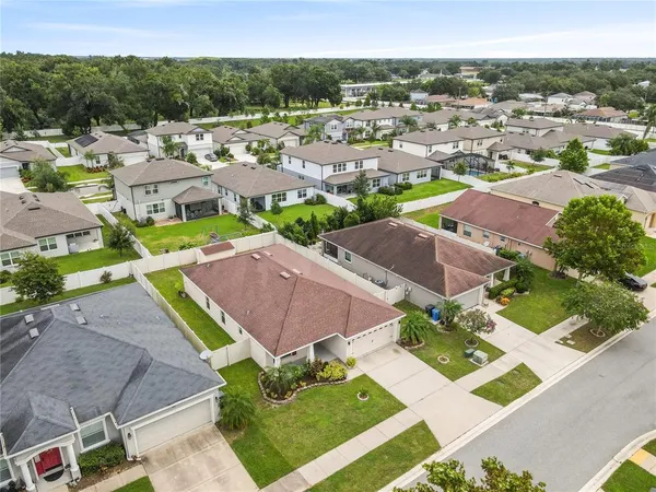 an aerial view of residential houses with outdoor space