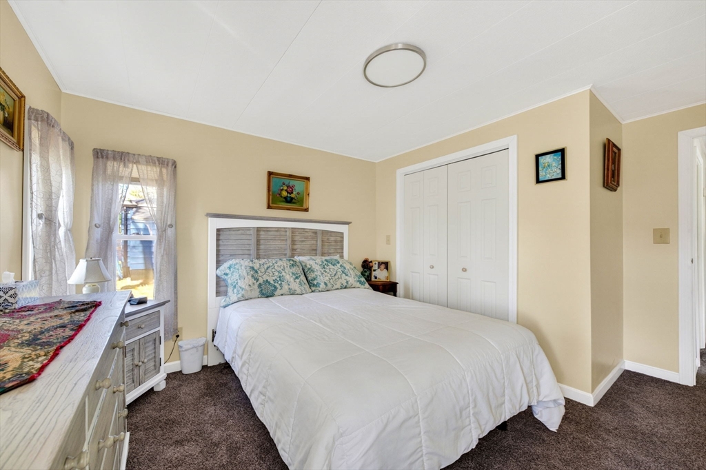 19 Timber Lane Wareham, MA 02571 - Photo 22 of 38 a bedroom with a large bed and a couch