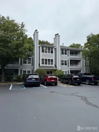 a car parked in front of a brick house