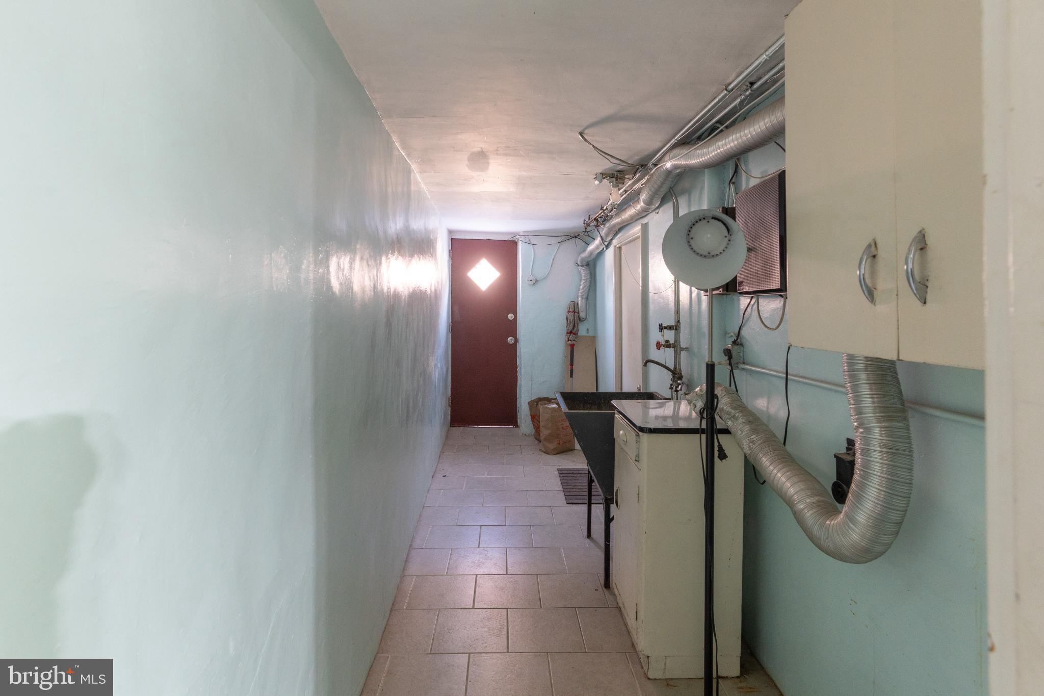 6755 Rutland Street Philadelphia, PA 19149 - Photo 19 of 21 Bright corridor with a welcoming door.