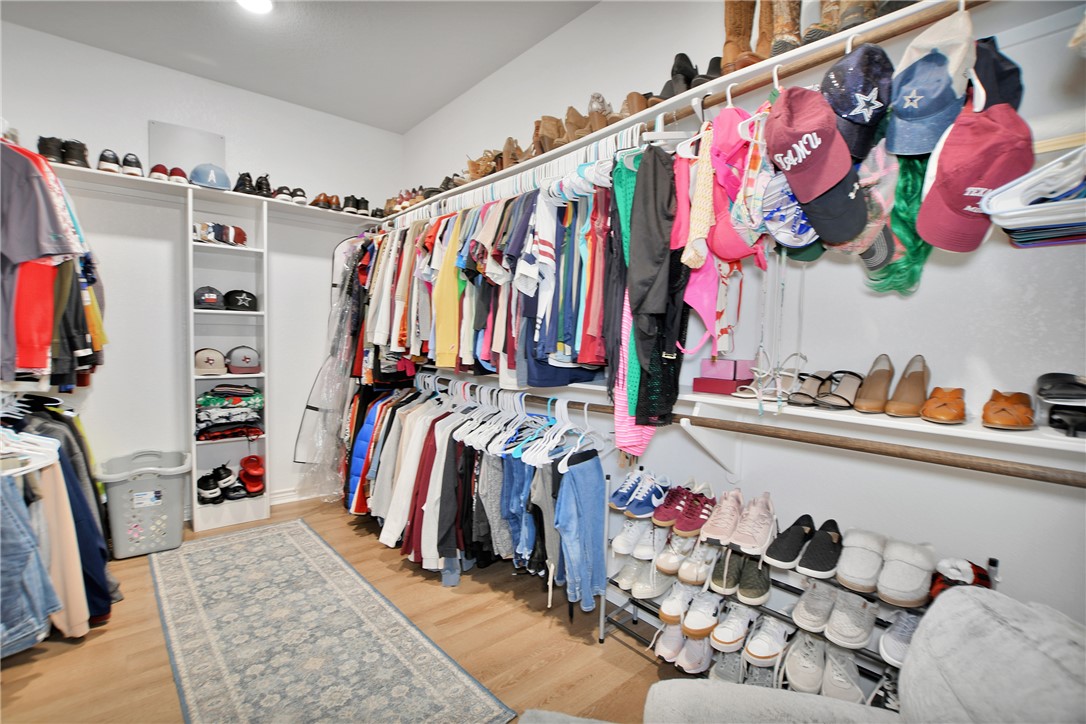 1908 Meridian Court Bryan, TX 77807 - Photo 27 of 46 Master offers a huge walk in closet and built in storage and shelves