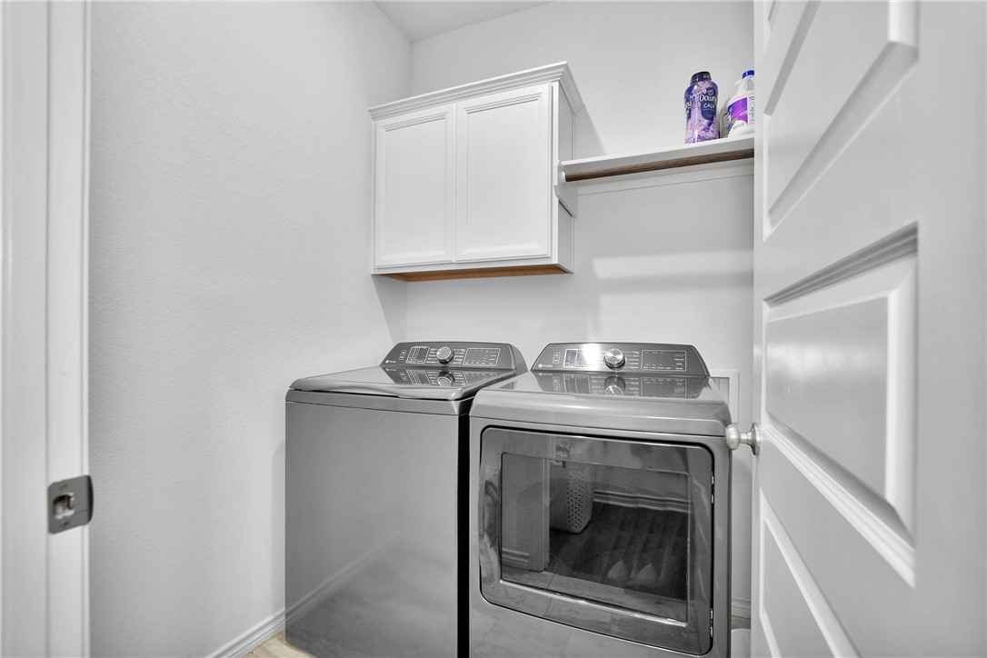 1908 Meridian Court Bryan, TX 77807 - Photo 32 of 46 Nice Laundry room with Storage and clothes rack
