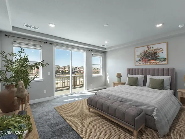 a spacious bedroom with a large bed and a large window