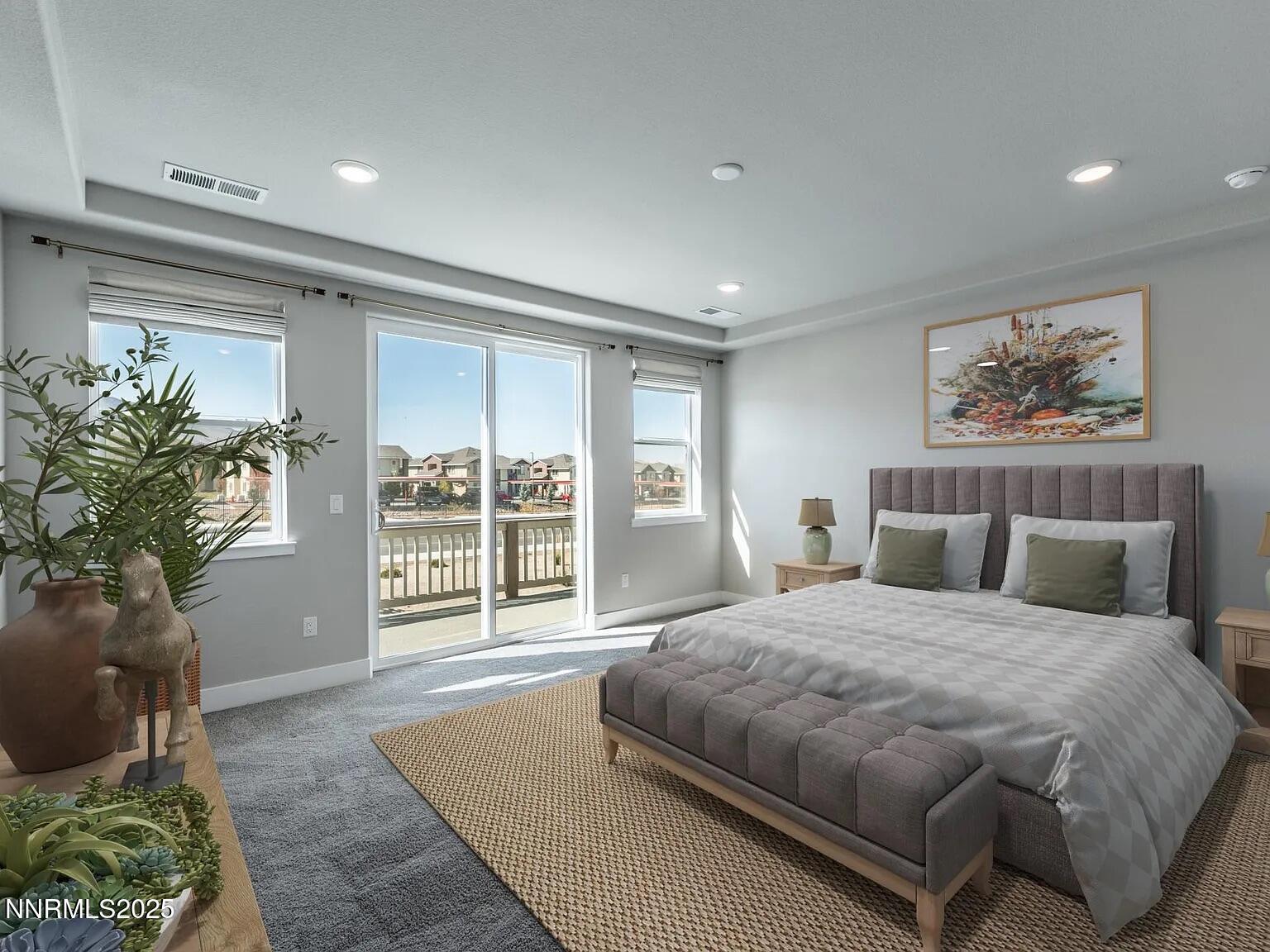 7731 Enclave Key Road Reno, NV 89506 - Photo 11 of 43 a spacious bedroom with a large bed and a large window