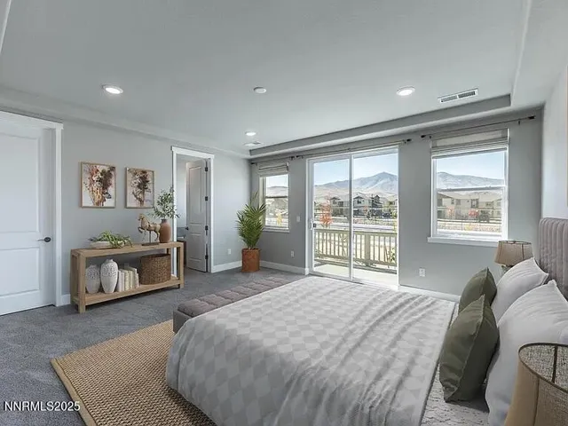 a spacious bedroom with a bed and a window