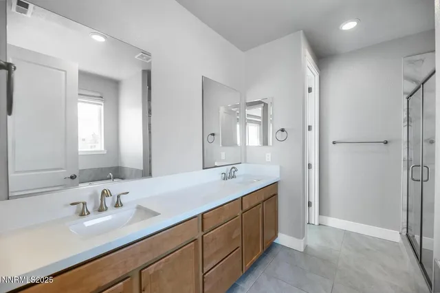 a bathroom with a granite countertop sink mirror and double