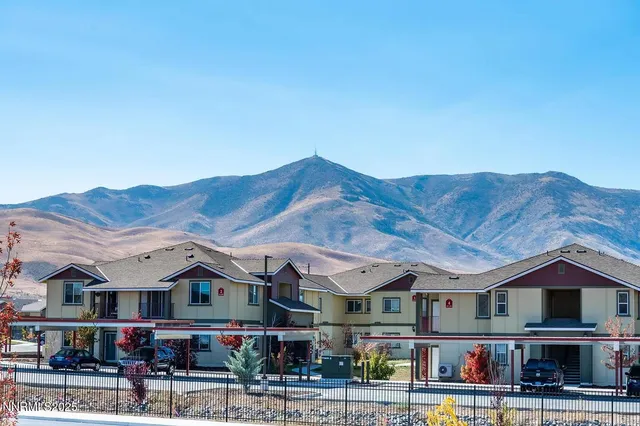 an aerial view of residential houses and street