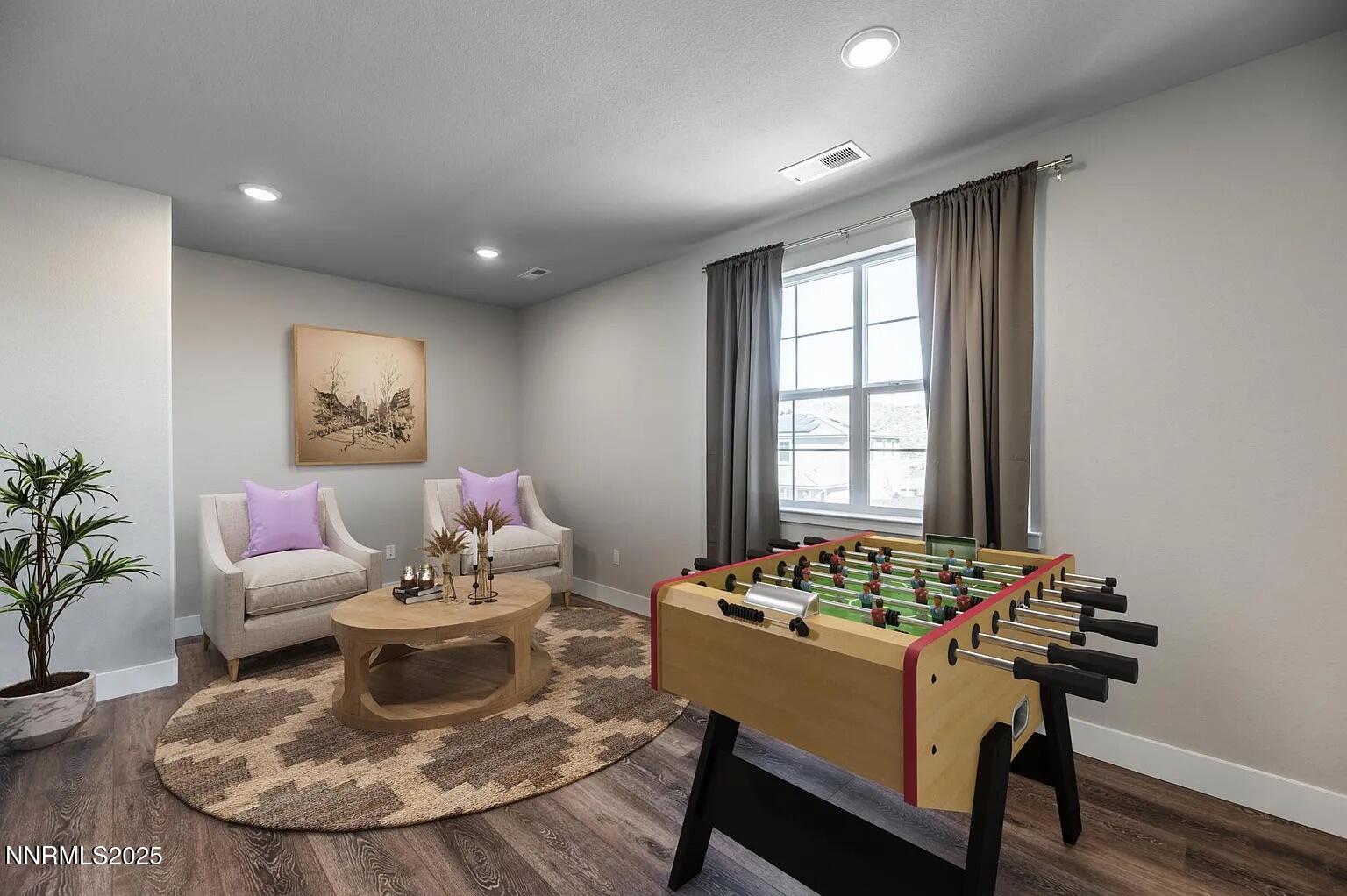 7731 Enclave Key Road Reno, NV 89506 - Photo 24 of 43 a living room with furniture and a potted plant