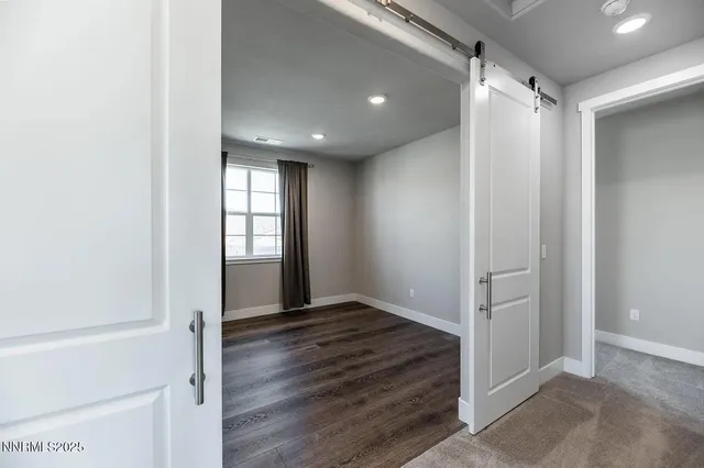 a view of entryway with wooden floor