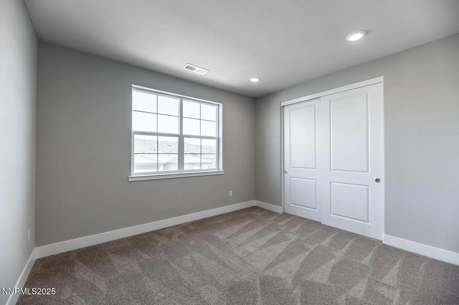 7731 Enclave Key Road Reno, NV 89506 - Photo 27 of 43 a view of an empty room with a window