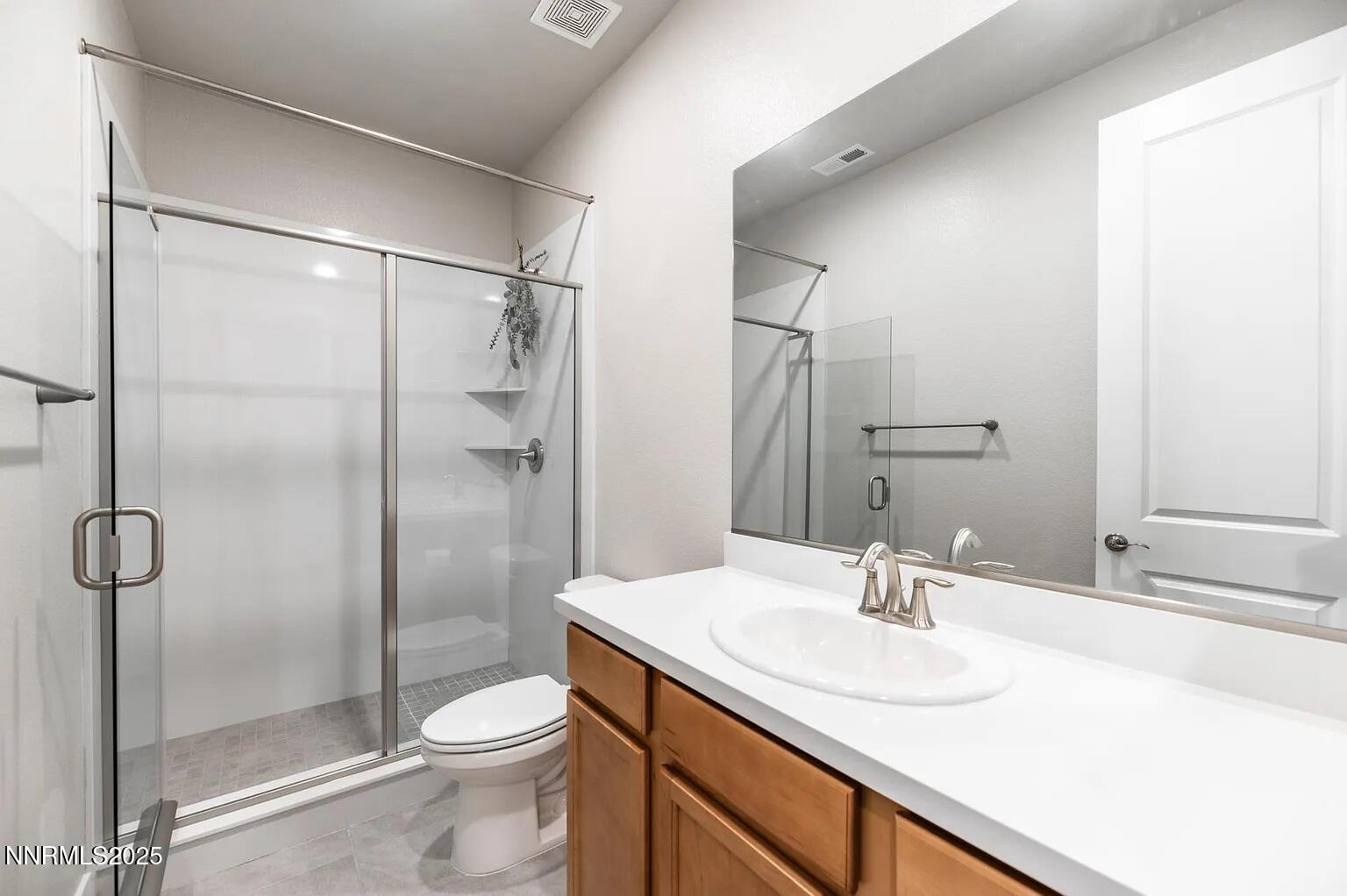 7731 Enclave Key Road Reno, NV 89506 - Photo 28 of 43 a bathroom with a sink toilet and shower