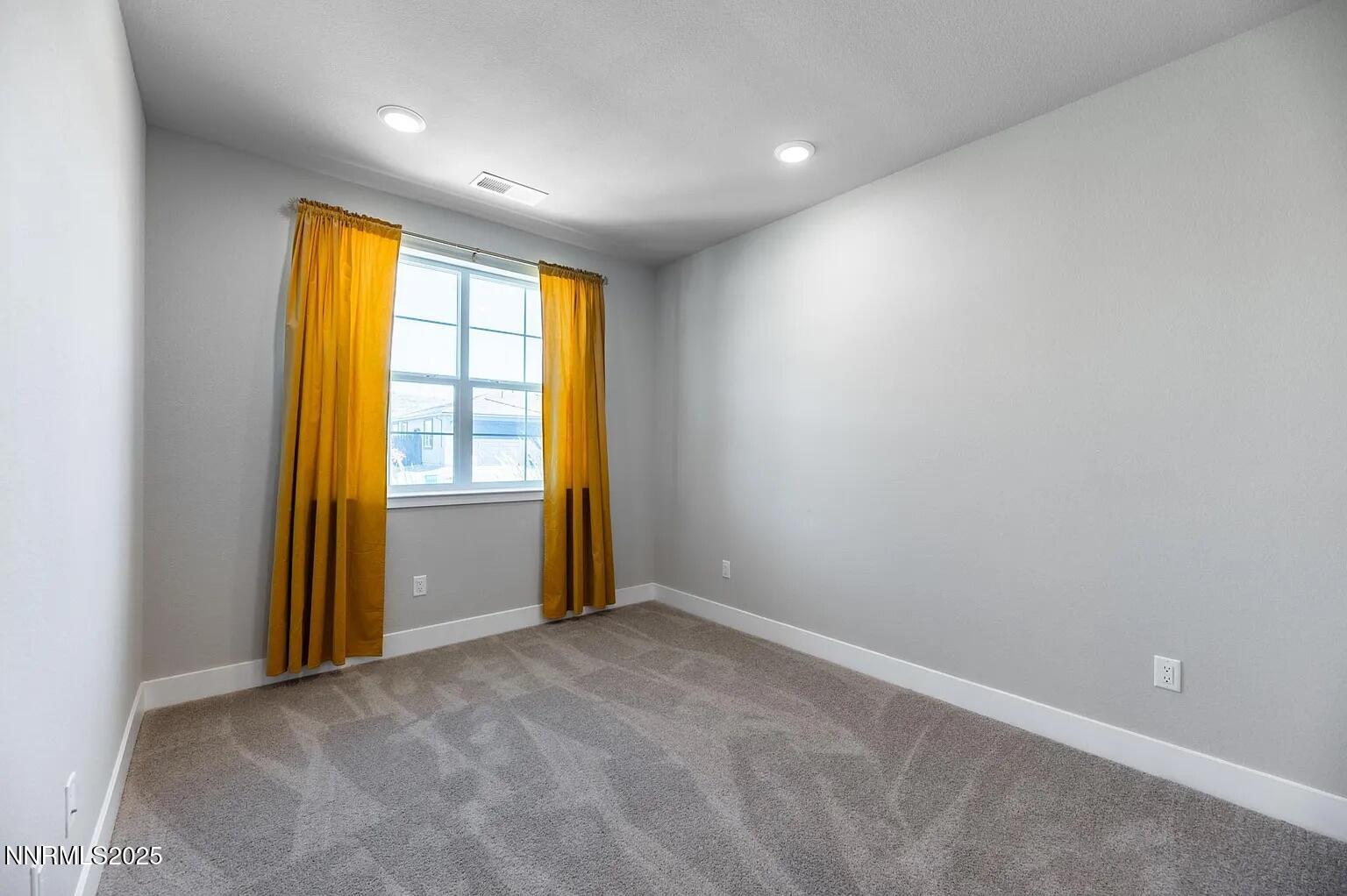7731 Enclave Key Road Reno, NV 89506 - Photo 29 of 43 an empty room with windows