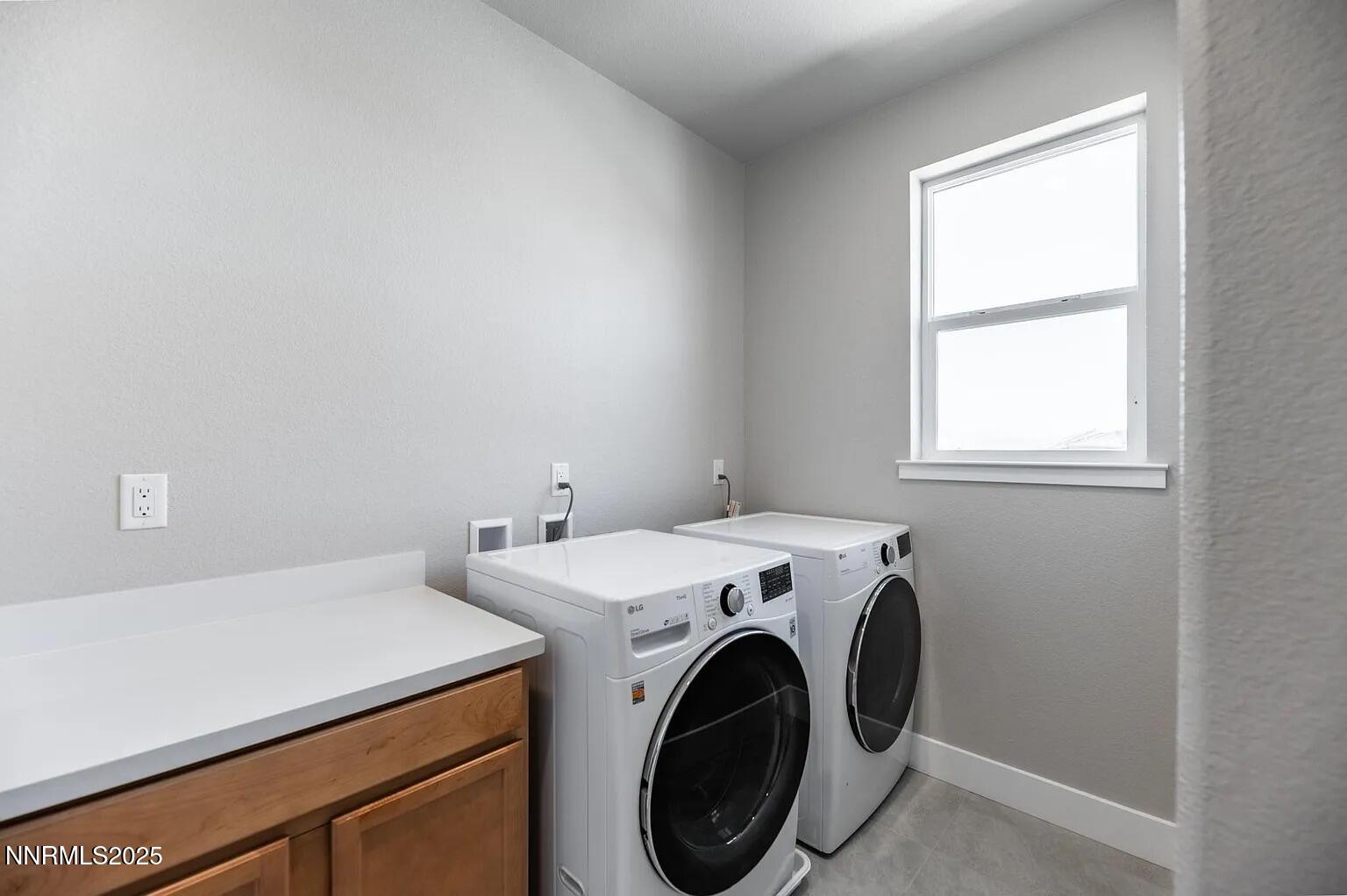 7731 Enclave Key Road Reno, NV 89506 - Photo 30 of 43 a utility room with dryer and washer