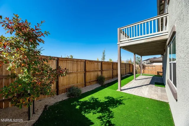 a view of a deck with a backyard