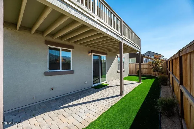 a view of a house with backyard and porch