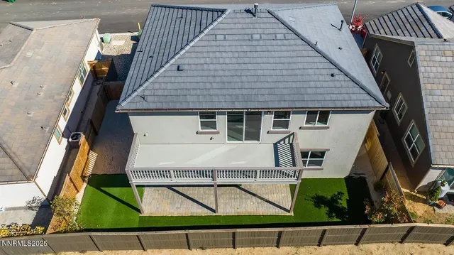 an aerial view of residential houses and outdoor space