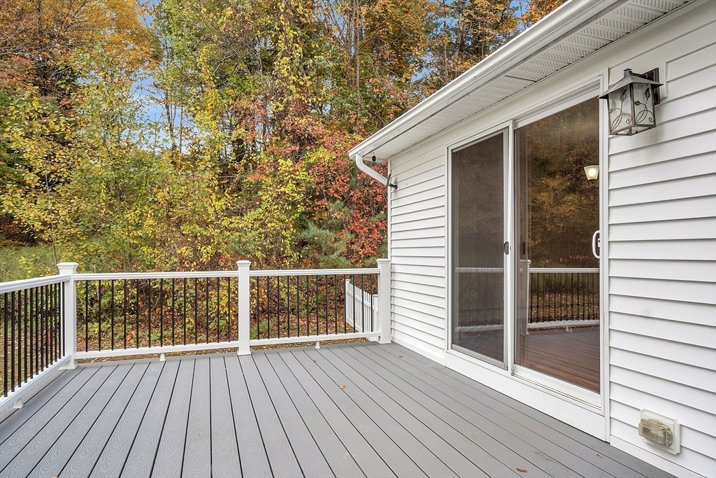 3 Reed Hill Road Wales, MA 01081 - Photo 11 of 23 a view of a balcony with wooden floor and fence