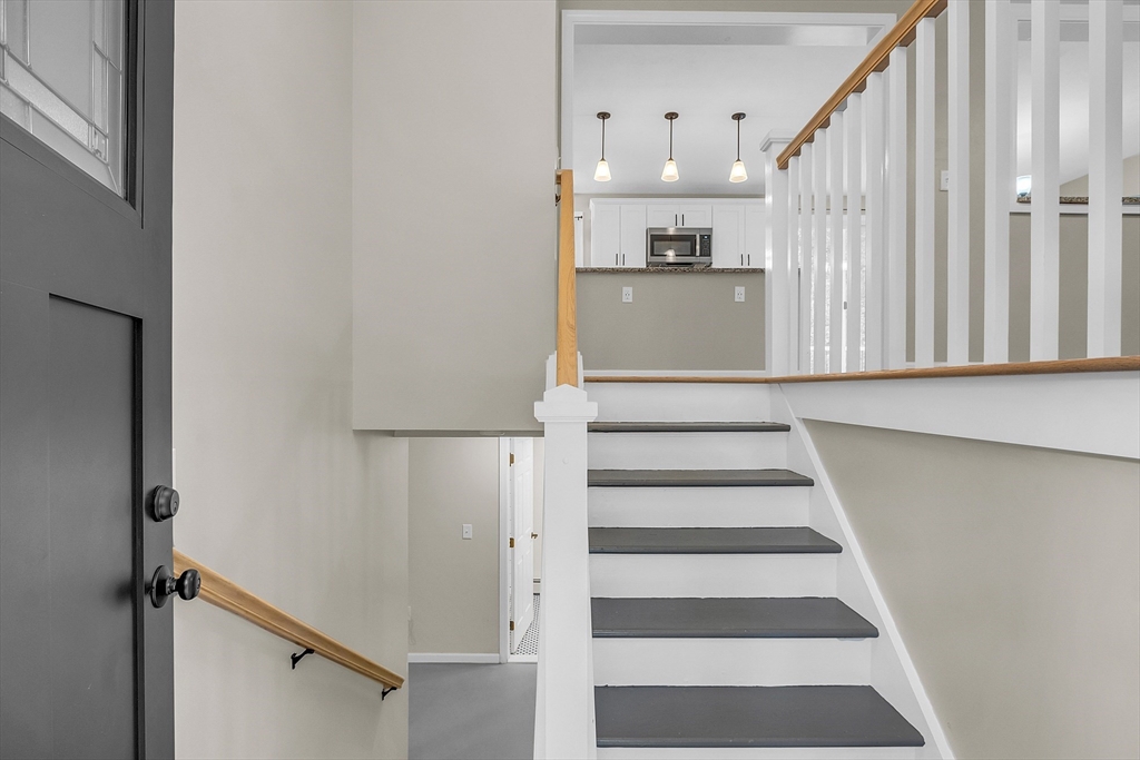 3 Reed Hill Road Wales, MA 01081 - Photo 14 of 23 a view of a kitchen with wooden floor and stairs
