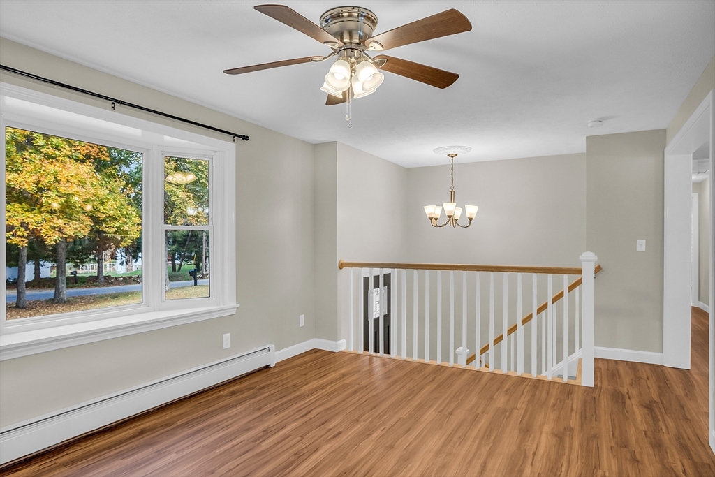 3 Reed Hill Road Wales, MA 01081 - Photo 16 of 23 a view of empty room with wooden floor and fan