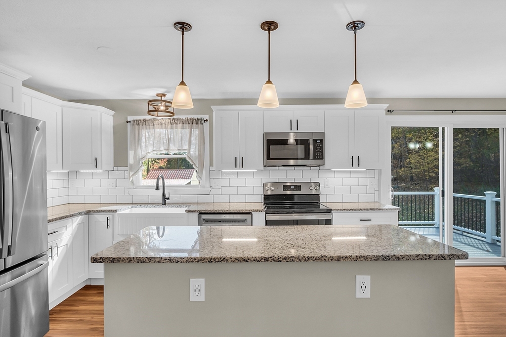 3 Reed Hill Road Wales, MA 01081 - Photo 20 of 23 a kitchen with stainless steel appliances granite countertop a sink and a granite counter tops