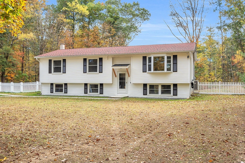 3 Reed Hill Road Wales, MA 01081 - Photo 2 of 23 a front view of a house with a yard