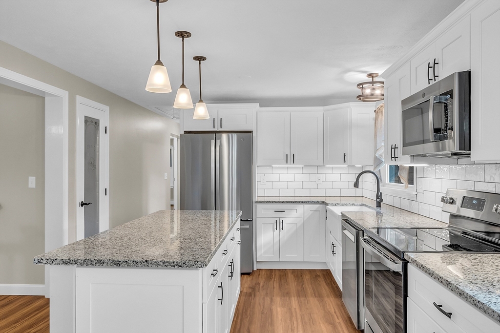 3 Reed Hill Road Wales, MA 01081 - Photo 22 of 23 a kitchen with stainless steel appliances granite countertop a sink stove and refrigerator
