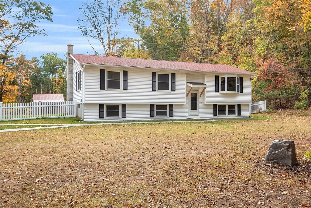 3 Reed Hill Road Wales, MA 01081 - Photo 3 of 23 a front view of a house with a yard