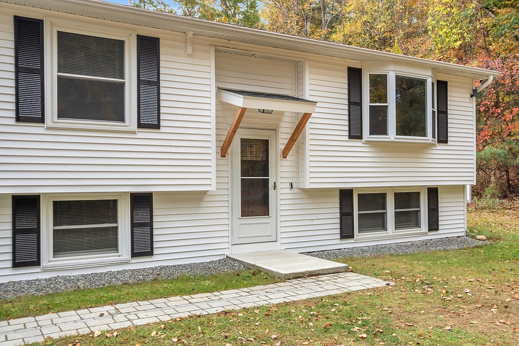 3 Reed Hill Road Wales, MA 01081 - Photo 4 of 23 a front view of a house with a yard
