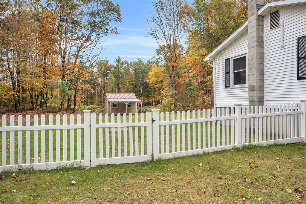 3 Reed Hill Road Wales, MA 01081 - Photo 6 of 23 a view of a house with a wooden fence