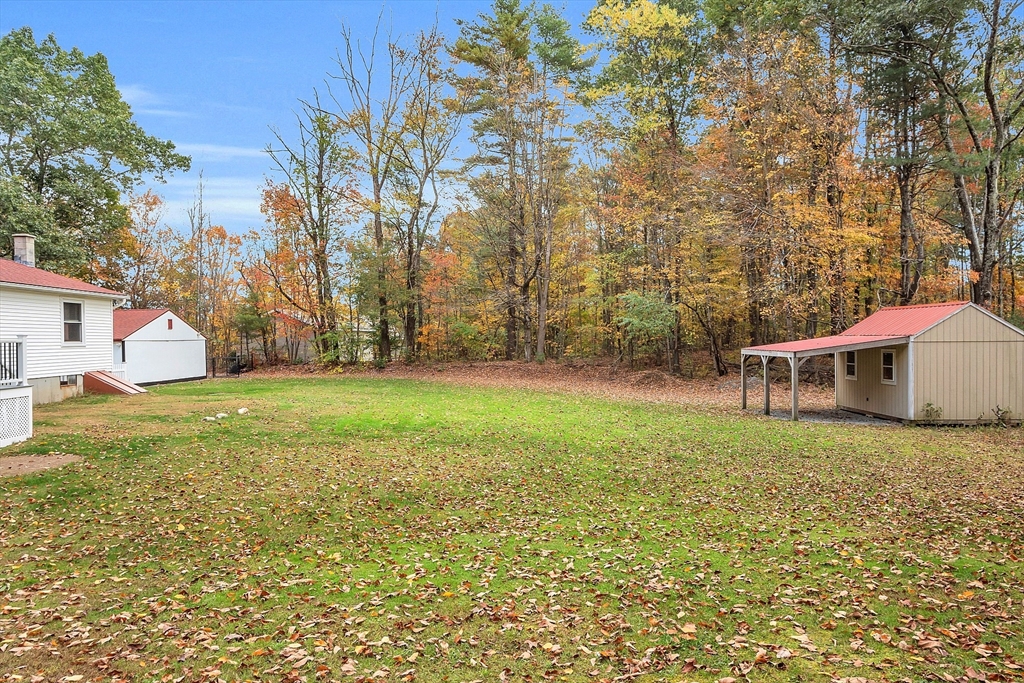 3 Reed Hill Road Wales, MA 01081 - Photo 10 of 23 a backyard of a house with lots of green space